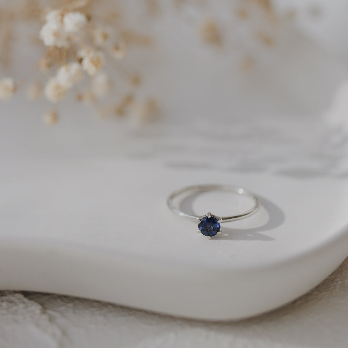 Solitaire Blue Sapphire Ring in Six Prong Setting Orizzo fine jewelry