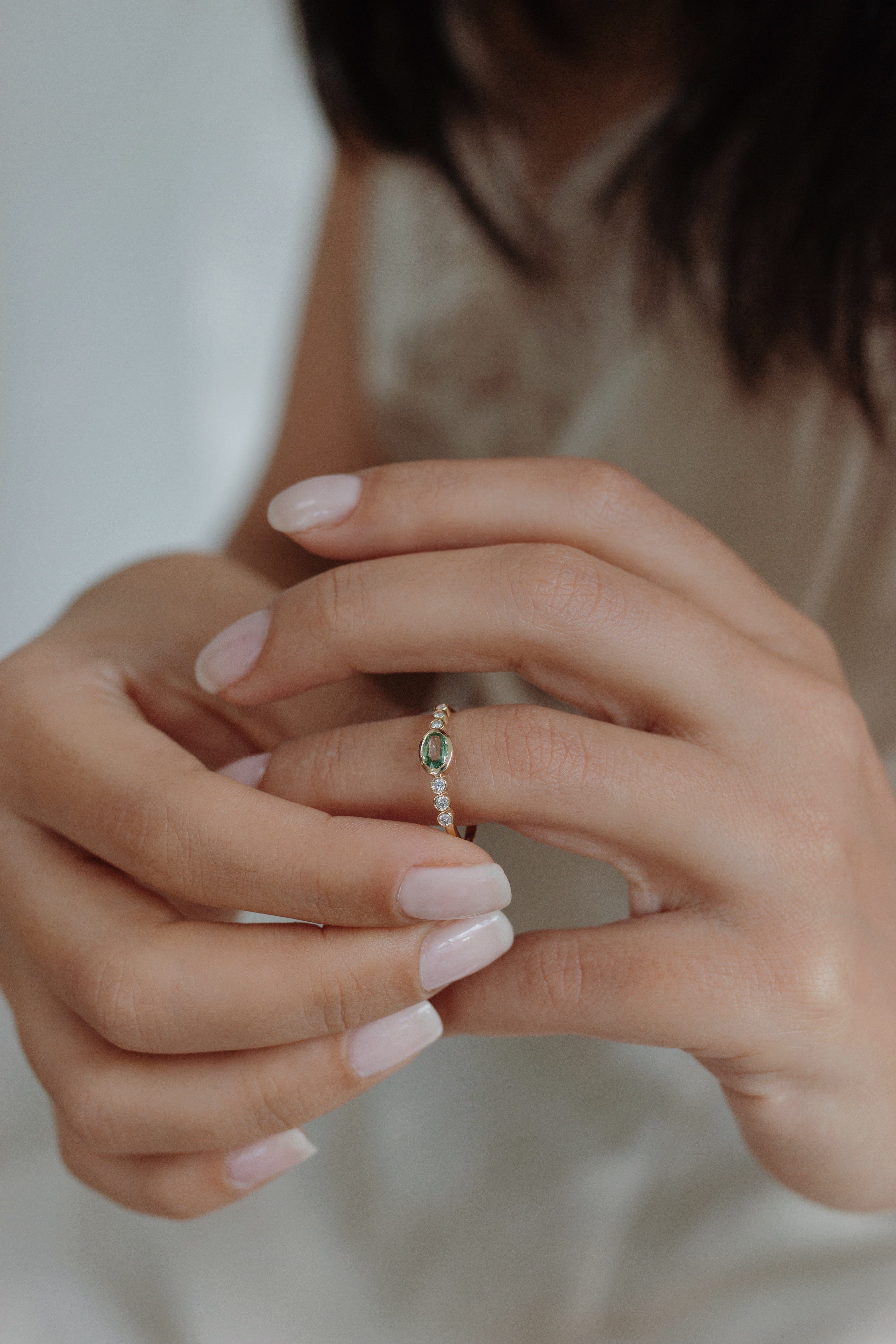 Oval Green Sapphire Engagement Ring With Diamond in Bezel Setting Orizzo fine jewelry