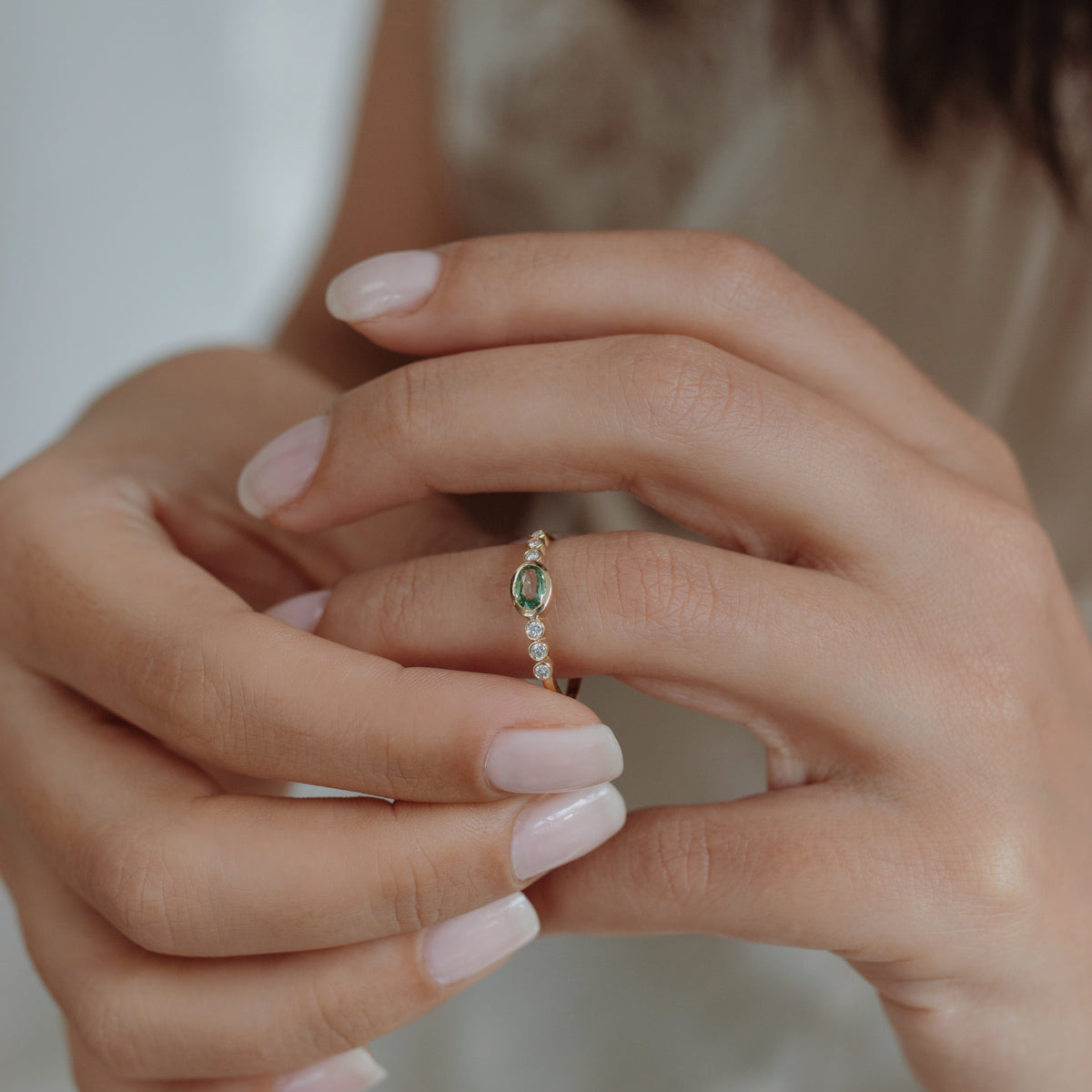 Oval Green Sapphire Engagement Ring With Diamond in Bezel Setting Orizzo fine jewelry