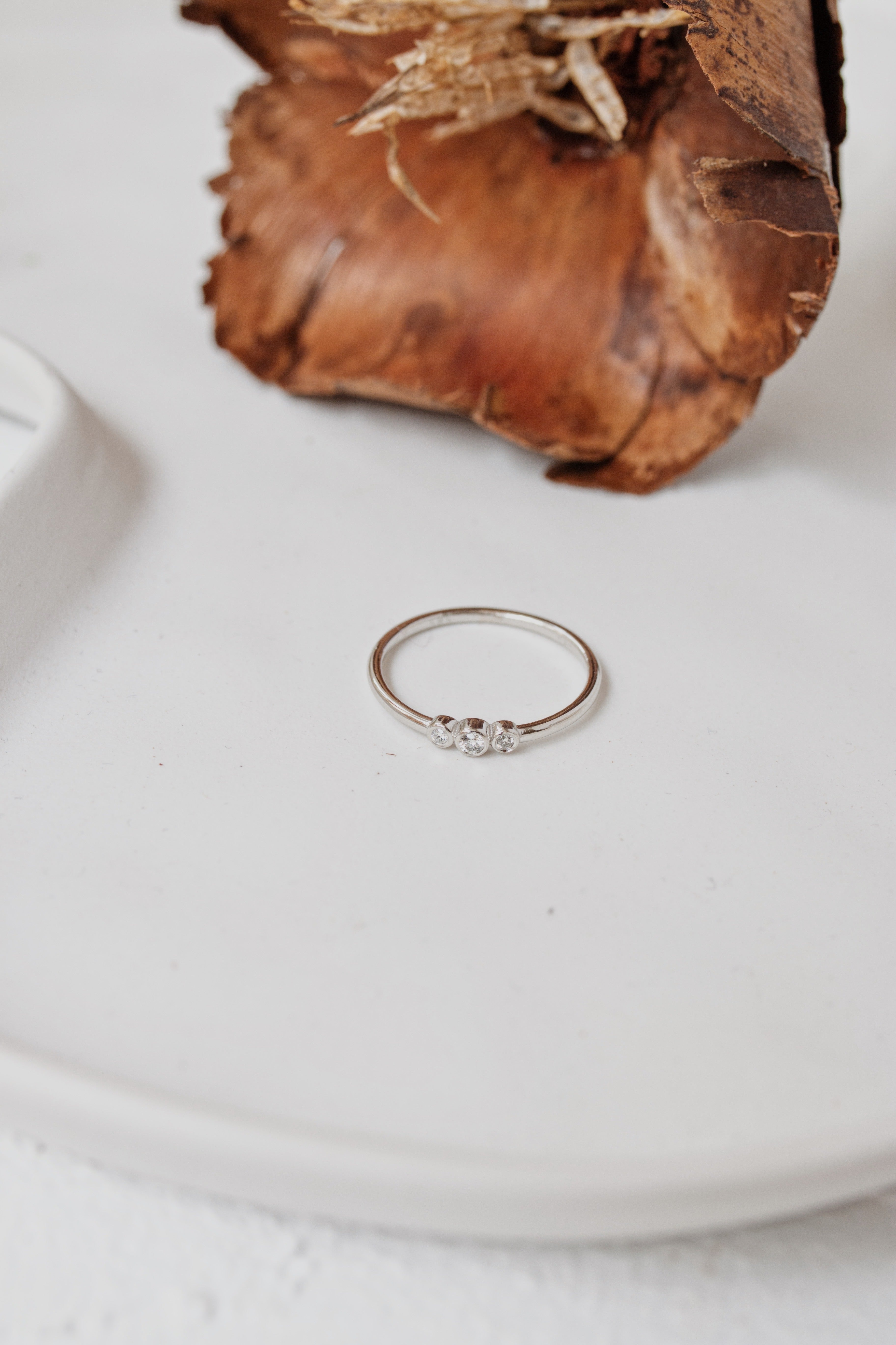 Three Stone Diamond Ring in a Bezel Setting Orizzo fine jewelry