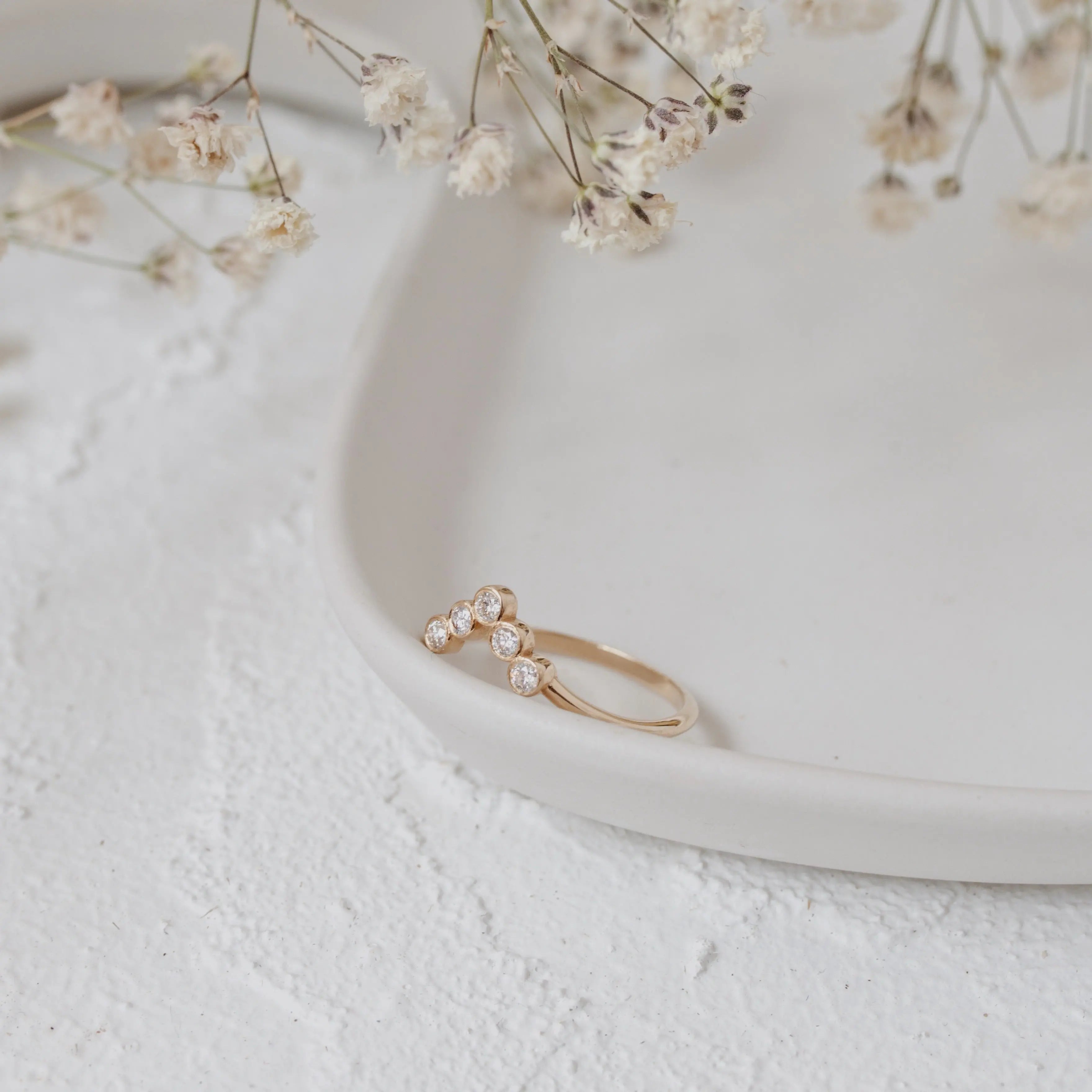 Bezel Set Curved Diamond Wedding Band in 14k Gold Orizzo fine jewelry