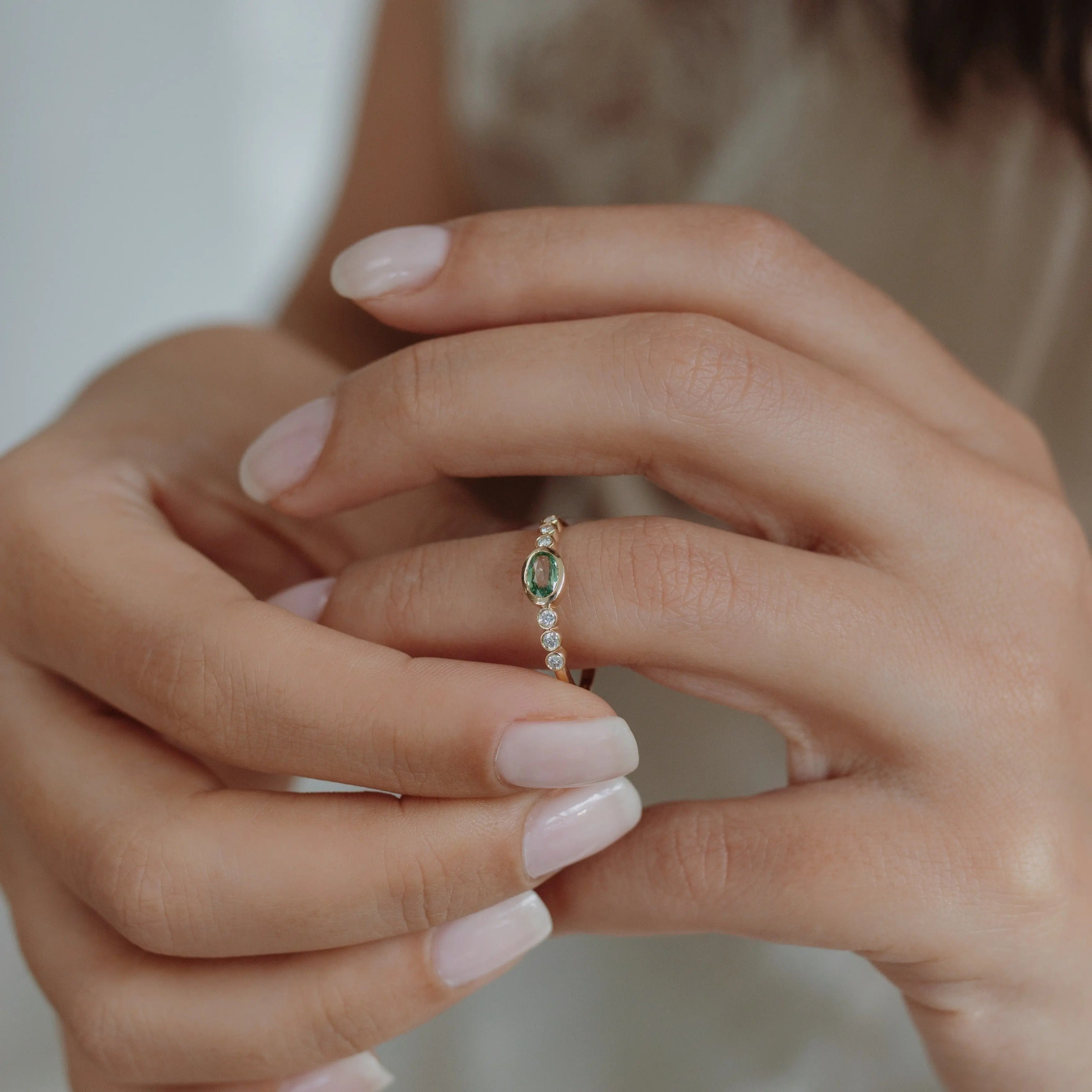 Oval Green Sapphire Engagement Ring With Diamond in Bezel Setting Orizzo fine jewelry